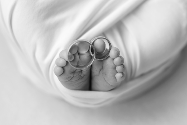 little-feet-of-a-newborn-baby-with-his-parents-we-2021-12-17-01-34-32-utc-1